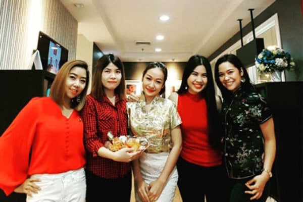 Modulo teachers and employees dressed for Chinese New Year